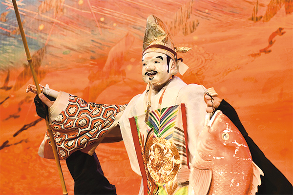 人形遣いが人形を操っている様子