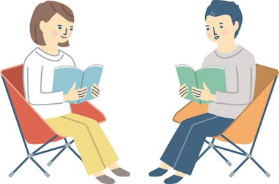 ガイドブックを読みながら対話しあう人たちのイメージイラスト